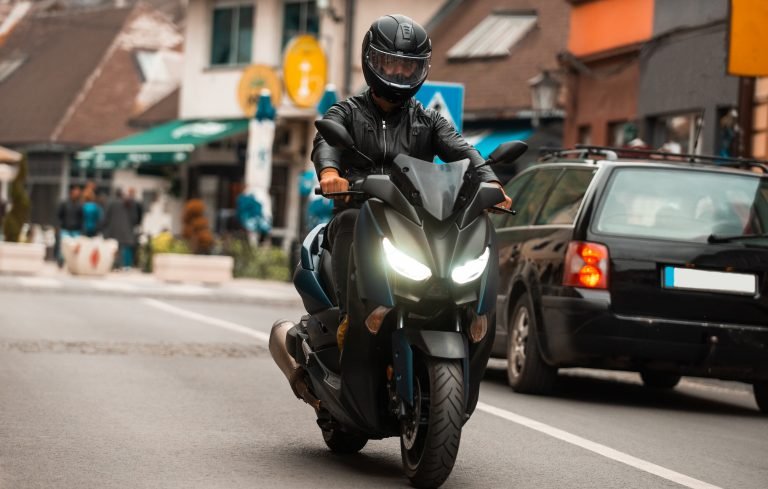 modern-motorcyclist-drives-motorcycle-road-city-2-768x489